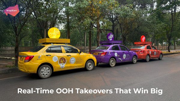 Cab advertising displaying real-time OOH campaign during a live cricket match celebration.