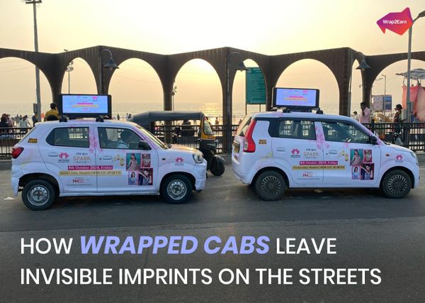 Branded cab driving through a city street, showcasing Wrap2Earn’s mobile advertising in motion