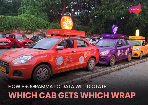 Colorful wrapped cabs with rooftop ads for 'The Big Zero Offer' showcasing programmatic ad targeting.