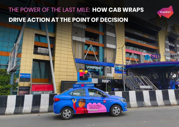 Wrap2Earn cab wrap driving through a busy city street during peak commute hours